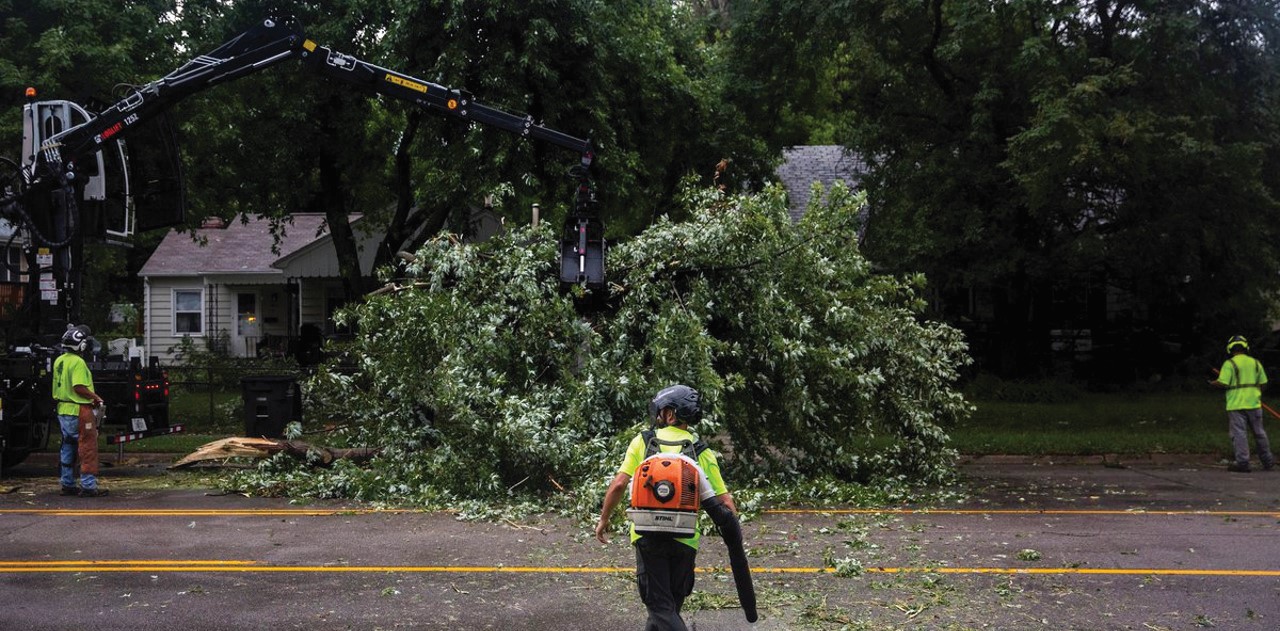 a photo of public works first responders removing downed trees