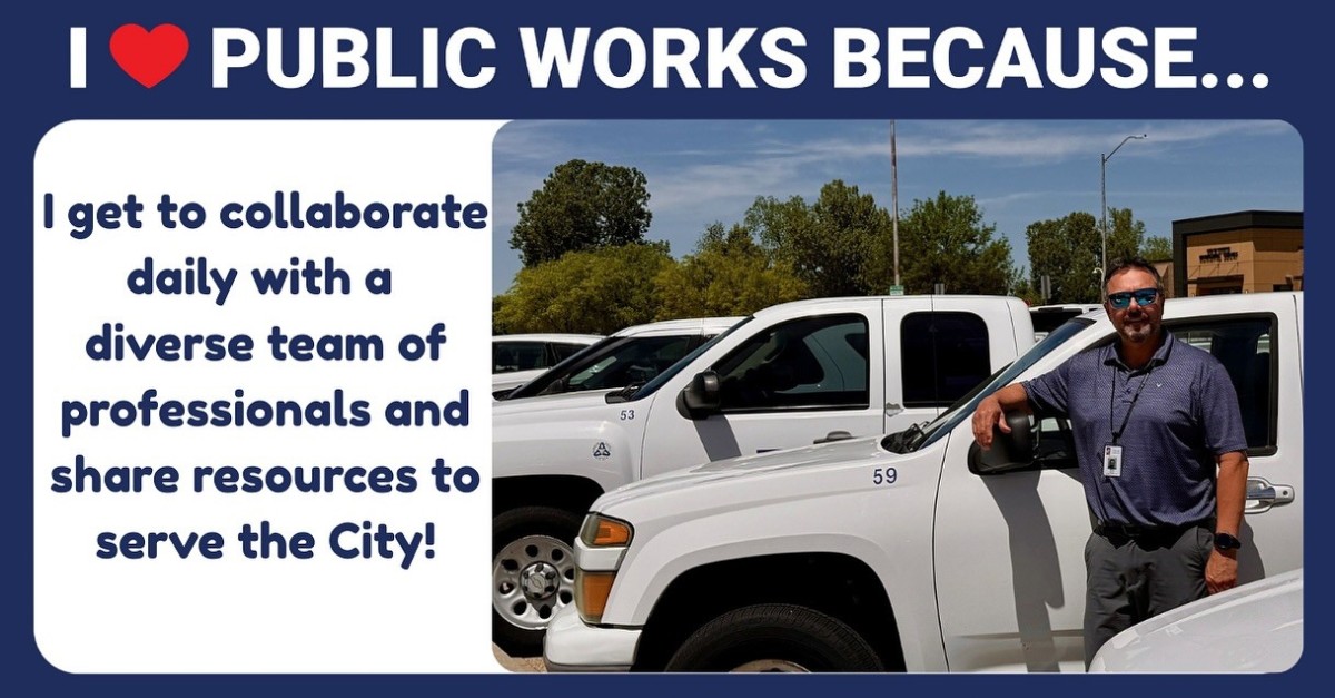 A sign that reads "I Heart Public Works Because I get to collaborate daily with a diverse team of professionals and share resources to serve the city! A photo of a man smiling next to a truck appears.