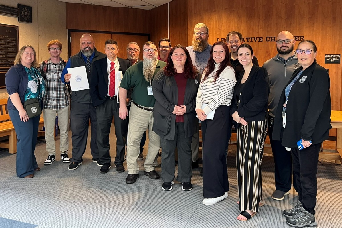Staff from the City of Omaha, Nebraska, smile for a picture with their National Public Works Week proclamation.