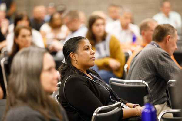 Attendee listens attentively during an education session