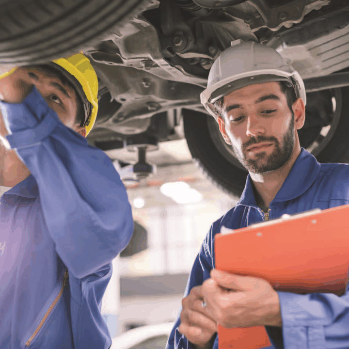 a photo of men working on a vehicle