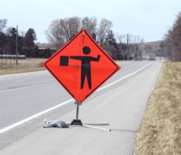 Road sign letting drivers know that down the road work is happening. 
